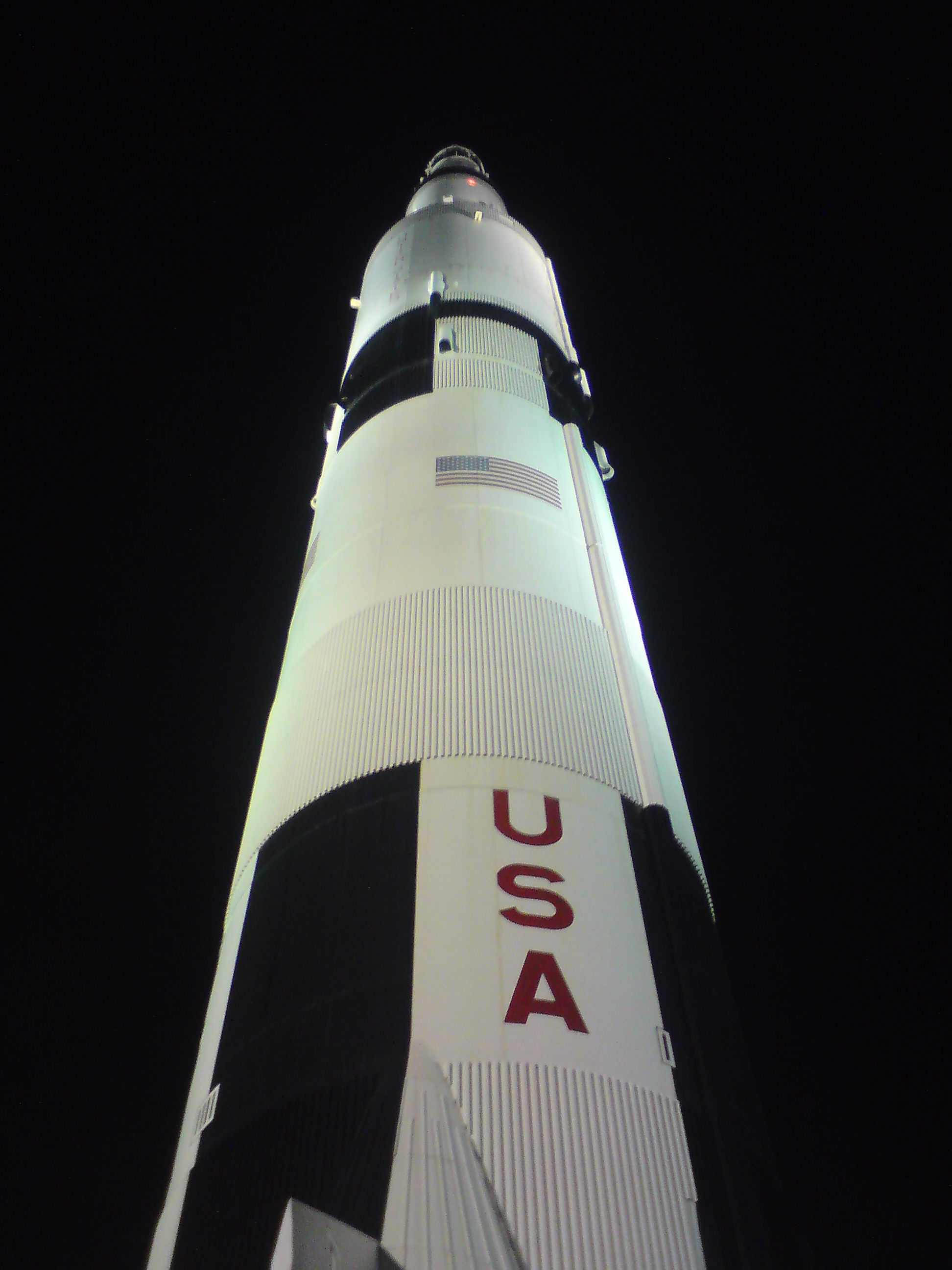 Saturn V replica illuminated at night in Huntsville